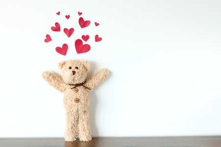 Teddy Bear with Hearts above it.