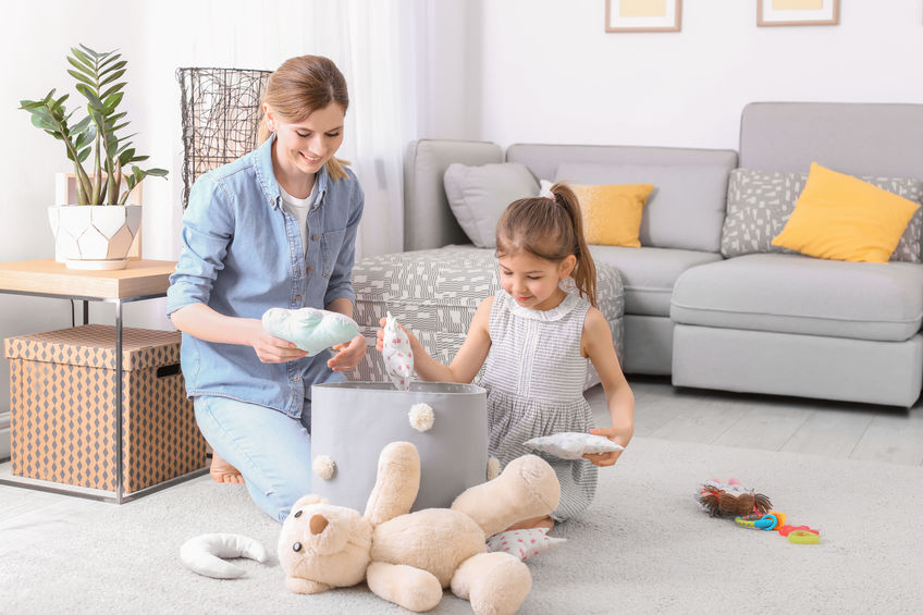 parent ad child cleaning with teddy bear