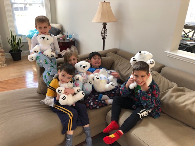 kids posing with their new stuffable animals